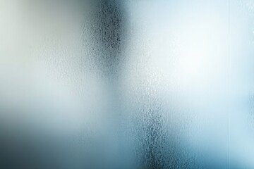 Abstract image of condensation on a glass surface, creating a textured, blurred background.