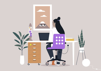 A designer engages with a laptop in a stylish workspace, surrounded by plants and unique decor, reflecting a blend of creativity and tranquility in a modern office environment