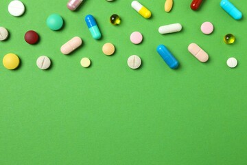 Various pills on color background, top view