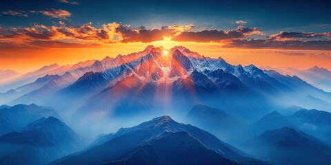 Golden sunlight illuminates rugged mountain peaks, creating a stunning dawn view