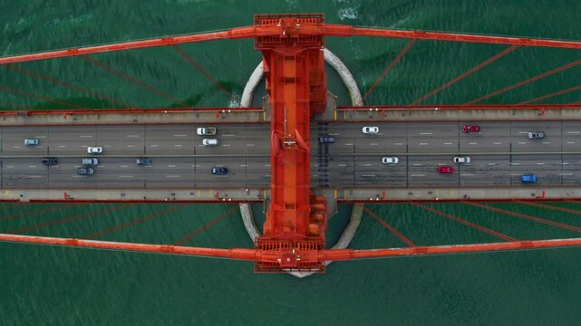 Aerial overhead view of the Golden Gate Bridge full of traffic. San Francisco, California. USA. High view of freeway during rush hour. US route 101  and SR 1 full of cars. Shot in 8K.