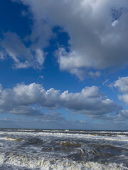 Fototapeta premium Rough sea and strong wind: show of waves and clouds