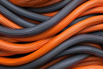 Durability of cables. Abstract close-up of intertwined wires in black and orange hues.
