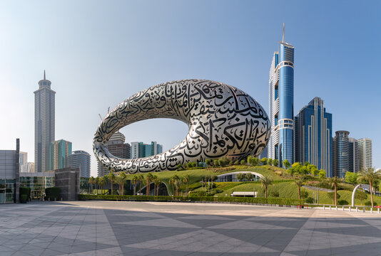 Dubai, United Arab Emirates - November 5, 2023: A picture of the Museum of the Future and the nearby Trade Centre buildings.