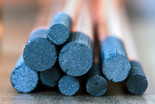 Copper-plated carbon electrode, bundle of rods made from rare earth materials