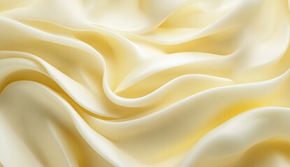 Fototapeta premium Creamy, pale yellow fabric drapes in soft folds