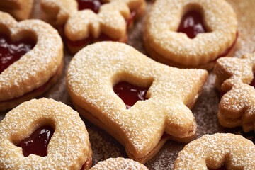 Homemade Linzer Christmas cookies filled with marmalade and dusted with sugar