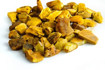 Unprocessed Polish Baltic amber displayed on white, capturing its authentic charm as a top jewelry material.