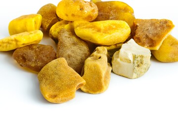 A crisp view of raw Polish Baltic amber on white, ideal for crafting elegant, nature-inspired jewelry.