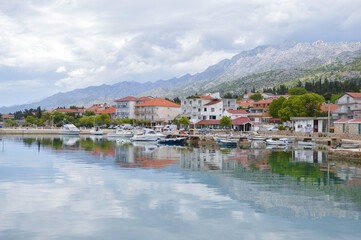 Fototapeta premium Starigrad Paklenica waterfront with calm sea and mountain Velebit at background