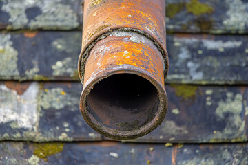 There is a close up of a roof with a rain gutter