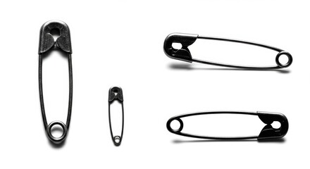 A minimalist arrangement of safety pins featuring different sizes and perspectives