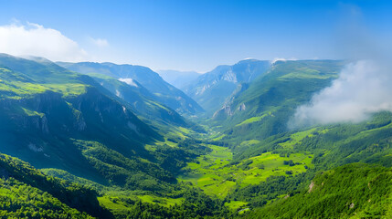 Fototapeta premium Aerial View Of Lush Green Valley With Mountainous Terrain And Blue Sky During Daylight