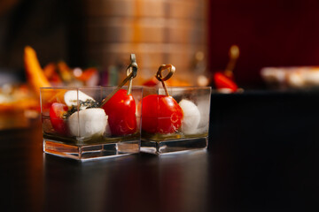 Two servings of La Caprese - a combination of fresh tomatoes, delicate mozzarella, fragrant dried basil and olive oil.