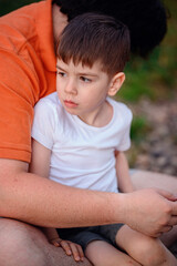 Father Comforting Son in Outdoor Setting