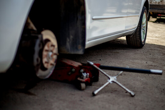car wheel repair at tire shop - Powered by Adobe