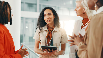 Explain, meeting and tablet with business women in lobby of office for discussion, planning or strategy. Collaboration, feedback and query with employee team in workplace for answers or review