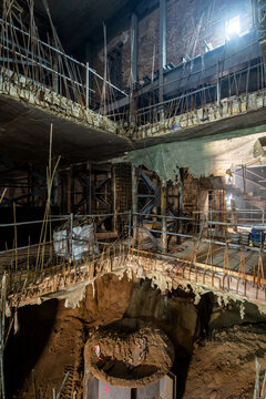 Interior view of construction site with exposed rebar and beams