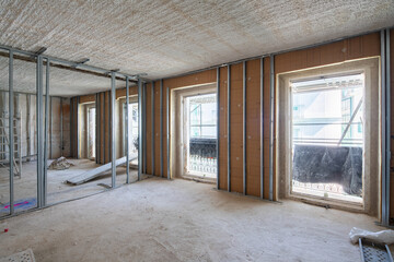 Interior renovation with exposed wall and window frames