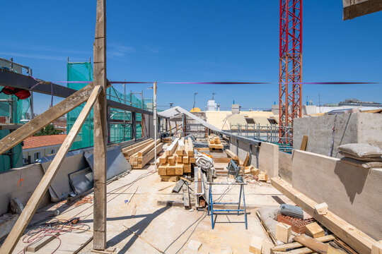 Construction site with materials and tools under clear sky