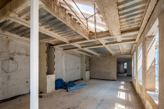 Interior construction site with exposed framework and tools