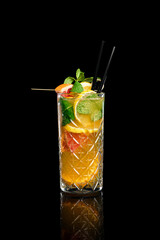 Citrus lemonade in a glass on a black background