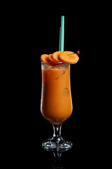 Carrot fresh juicy in a glass on a black background
