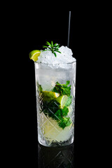 Mojito cocktail in a glass on a black background