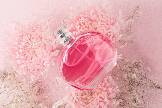 Elegant perfume bottle with floral pink aesthetics