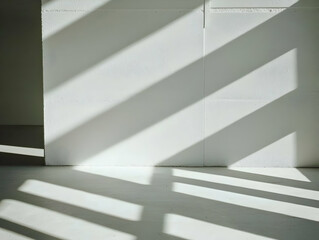 Obraz premium Sunlight streams through window onto white wall, minimalist interior design, architectural detail, modern building