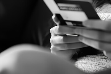 Closeup Black and White Hands Holding Credit Card Online Shopping Payment Banking Finance Modern Technology Digital Purchase Secure Transaction Financial Services Ecommerce        