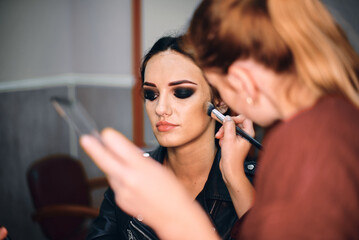 Professional Makeup Artist Creating a Bold Look