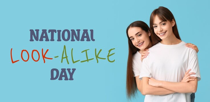 Beautiful young twin sisters on light blue background. Banner for National Look-Alike Day