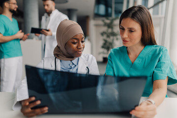 Medical professionals examining x ray in hospital setting