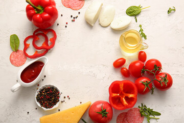 Frame made of ingredients for preparing pizza on light background