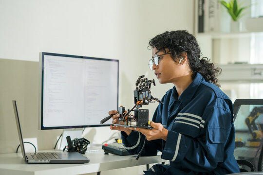 Remote worker in digital lab, programming systems and exploring tech innovations.

