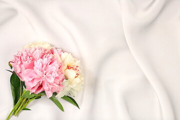 Abstract beautiful floral arrangement of fresh peony bouquet.Stage for product display and business concept.Minimal modern aesthetics, elegant beauty concept, selective focus