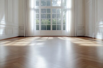 Spacious, sunlit room with hardwood floors and large windows