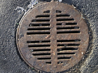 cast iron sewer manhole cover close-up