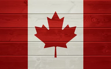 Wall murals Flag of Canada on an old wooden surface.