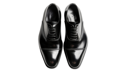 Pair of black leather oxford cap-toe dress shoes isolated on transparent background