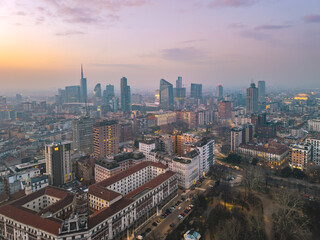 Fototapeta premium Twilight aerial drone view of Milan’s Porta Nuova and Porta Garibaldi