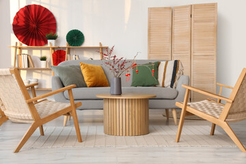 Interior of living room with sofa, armchairs and decor for Chinese New Year celebration