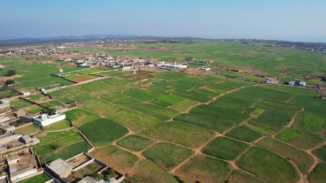 Aerial view of village between hills in Chakwal, Pakistan.