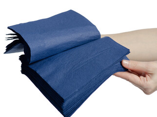 Hand holding serving paper blue napkins on white background isolation