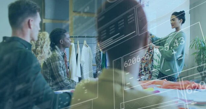 Presenting colorful garment, fashion designer with diverse team in office setting