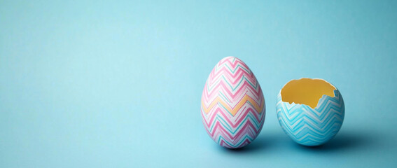 Obraz premium Pink and blue Easter egg split open and cracked in two. Blank space available for text or product. 