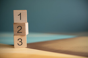 1, 2,3,  order numbers stacked by wood cubes with copy space, priority, process, or instruction 
