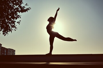 Obraz premium Woman dances outdoors in sun with building backdrop