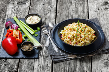 macaroni salad with celery, eggs, red bell pepper